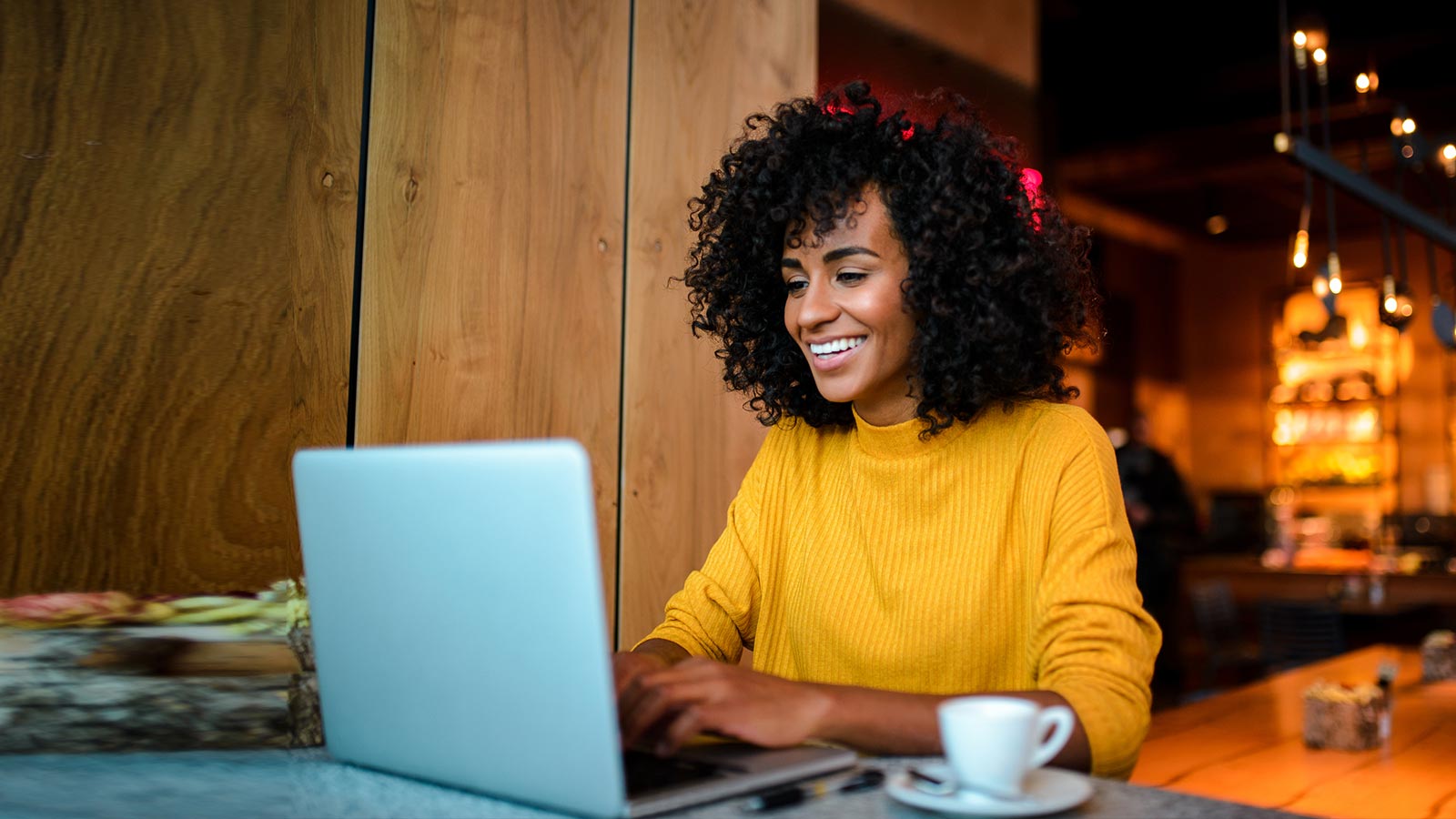 A woman using her laptop to make a secure online payment.