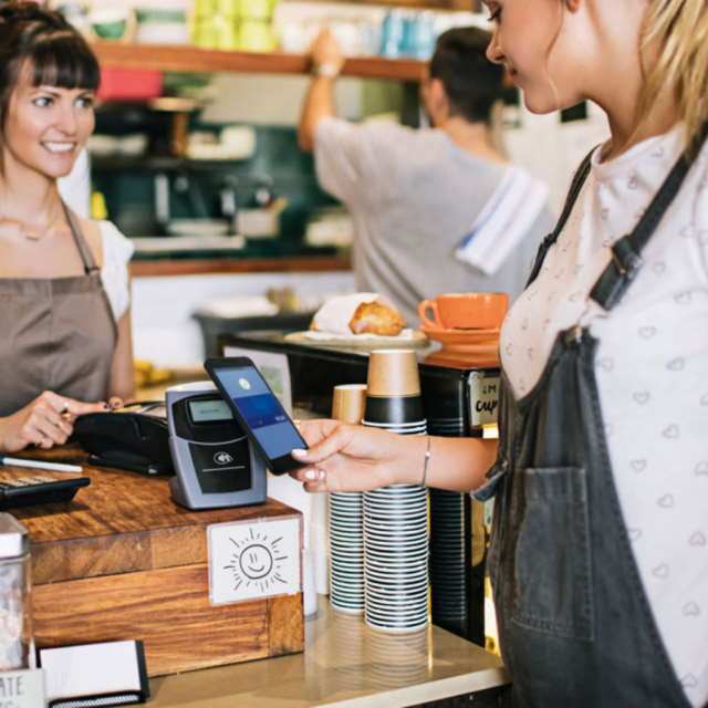 making contactless phone payment in shop