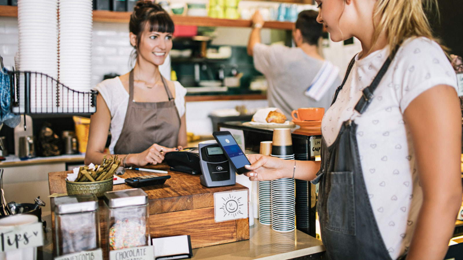 making contactless phone payment in shop